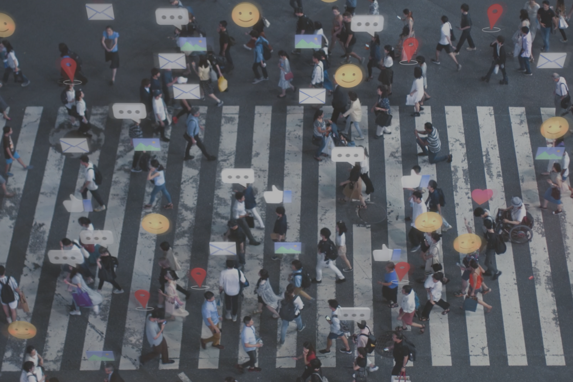 A crowd crosses the road with message icons above their head to represent digital transformation