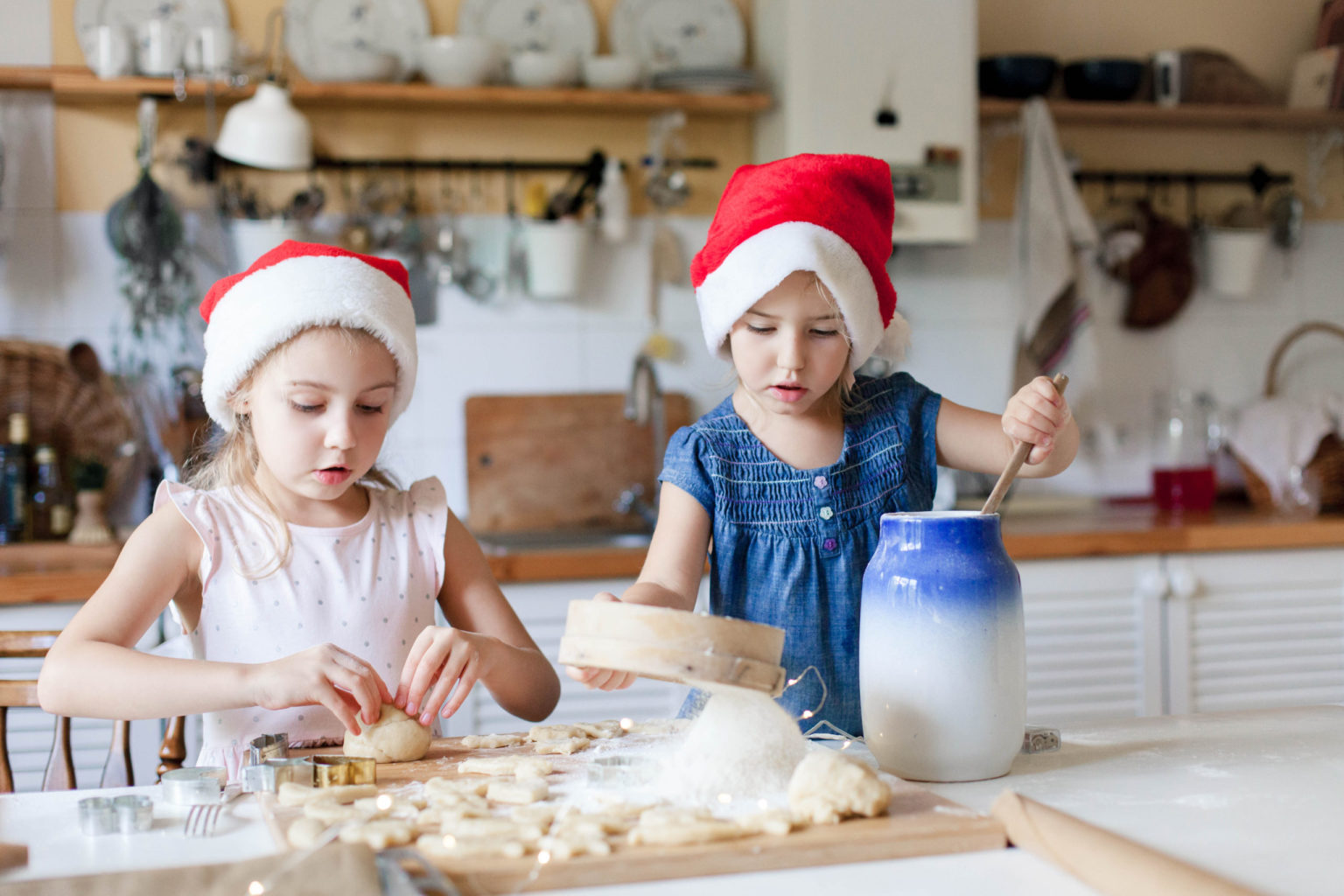 Children are cooking Christmas cookies in cozy home kitchen. Cute kids ...